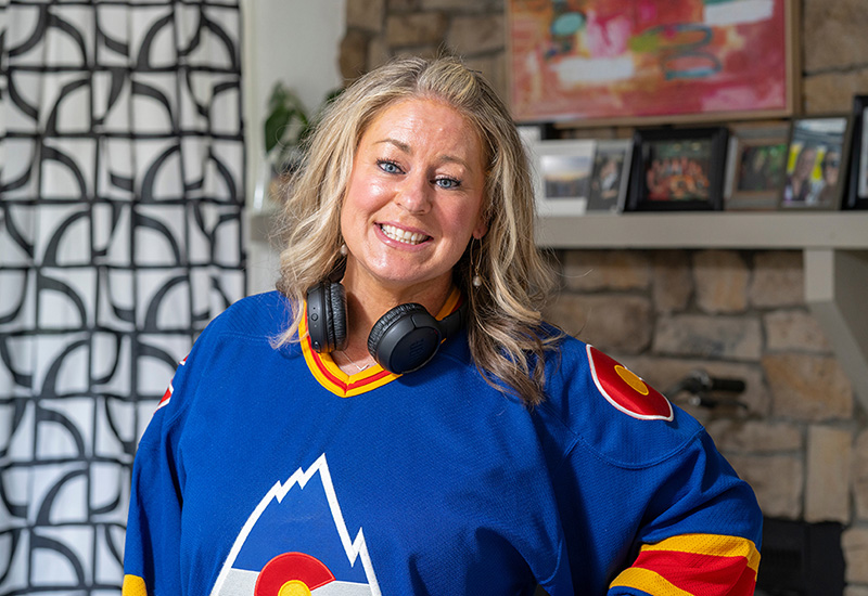 Mindi in a jersey in her living room