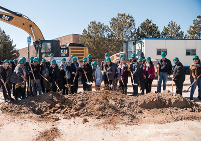 LinkGridPhotos-CHFAGolfImagery2025-BeneficiaryPhoto4-400x280.jpg a large group of people in hardhats and holding shovels at a groundbreaking