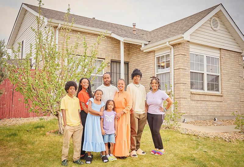 A family in front of their house